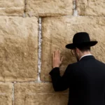 prayer at the western wall in jerusalem